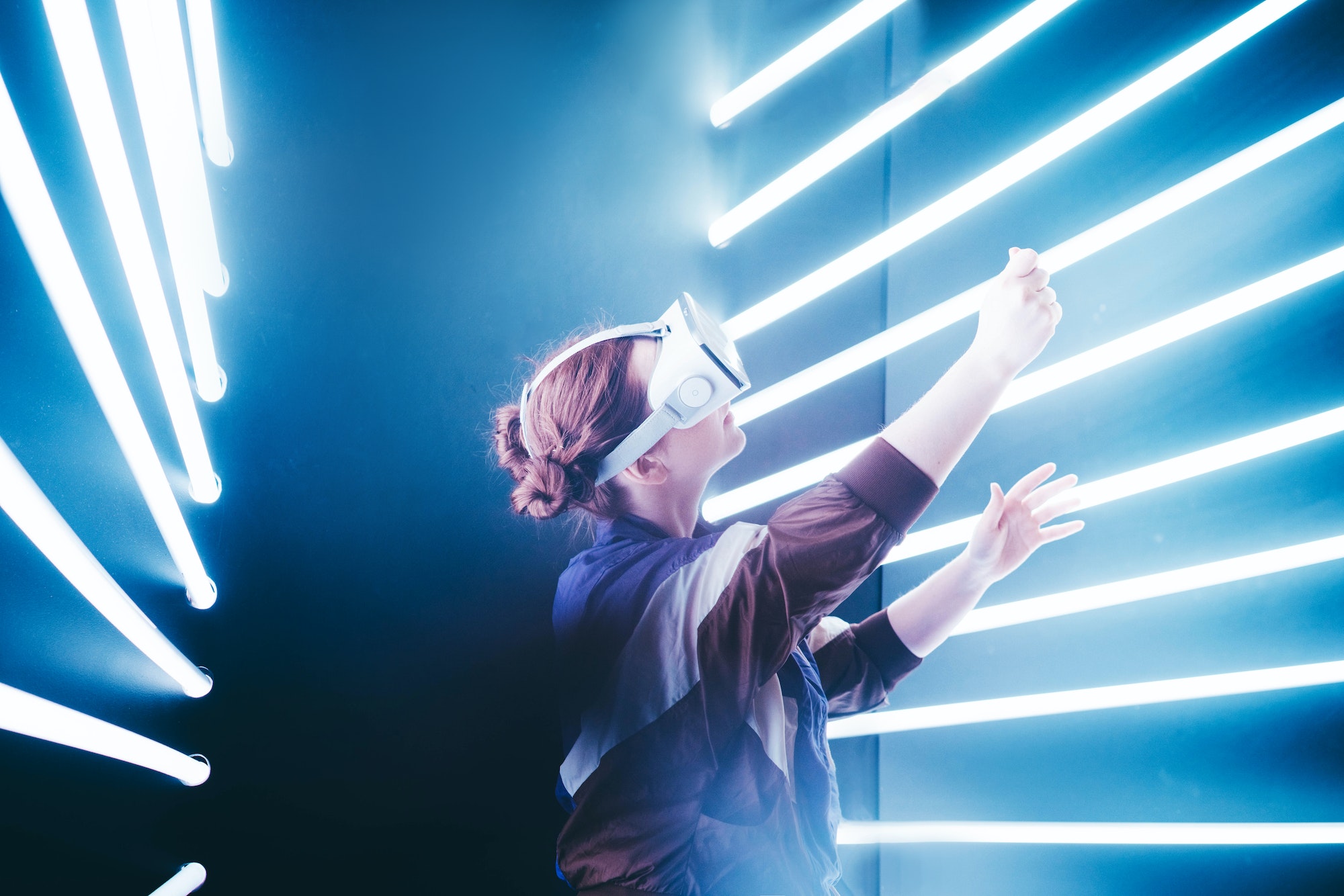 girl-using-vr-goggles-in-colorful-neon-lights.jpg